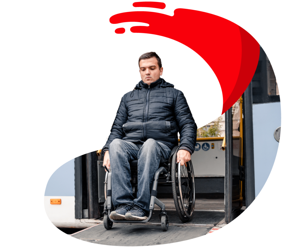 man with wheelchair getting off of the bus